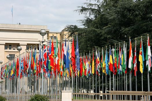 Palace of Nations - seat of the United Nations in Geneva, Switzerland. Flags of all countries.