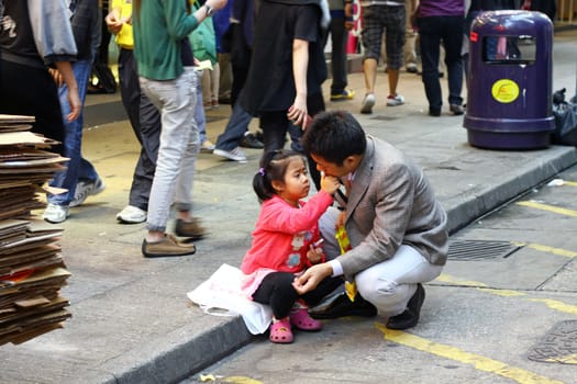HONG KONG - NOV 20, Father and daugher along the street in Hong Kong on 20 November, 2010.