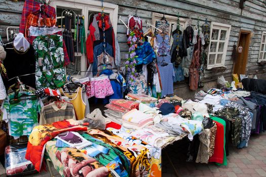 Market Bargains .Clothing at an outdoor flea market street stall