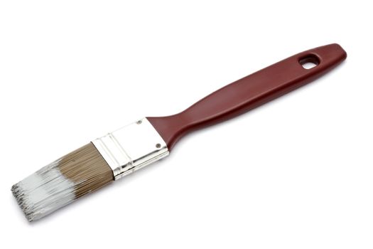 Paintbrush closeup on white background 
