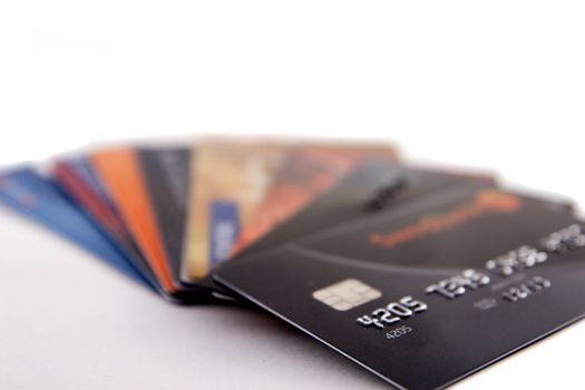 Stack of credit cards on white background
