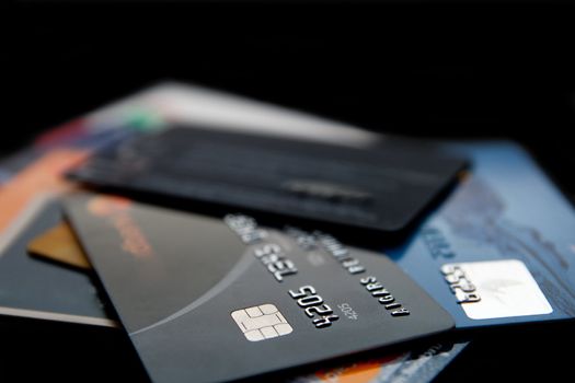 Stack of credit cards on a black background