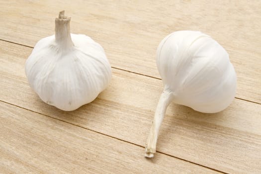 Garlic closeup on wood background 
