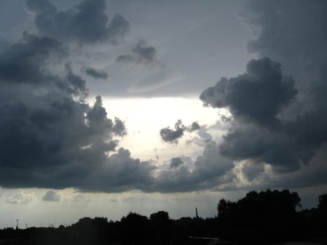 Evening landscape with beautiful picturesque clouds