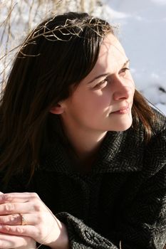 Beautiful brunette female outdoors on a sunny winters day