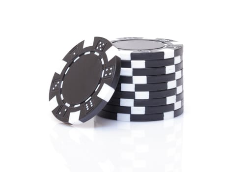 Small Stack of Black Poker Chips, closeup on white background