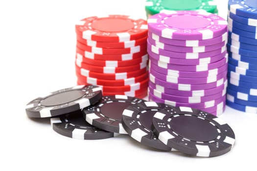 Stacks of Poker Chips, closeup on white background