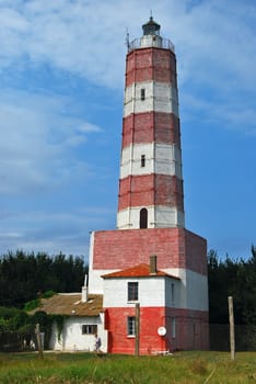 Old Black sea coastal red white lighthouse