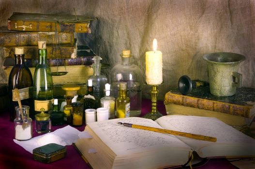 Still life with old books and apothecary dishes