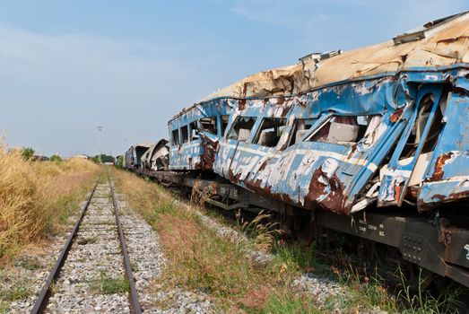 A wreckage of crashed or damaged train taken from train yard taken on sunny day, can be use for safety related communications
