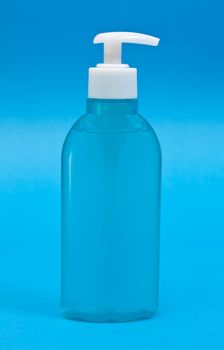 Plastic clean shampoo bottle isolated on a blue background