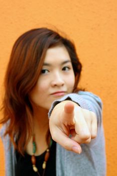 Asian woman pointing