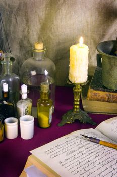 Still life with old books and apothecary dishes