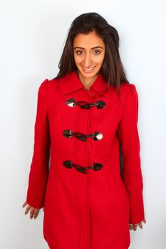 Beautiful East Indian teenage girl wearing a red coat