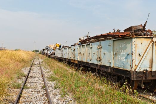 Railway looking forward with train wreckage on the right, taken on sunny day, can be use for safety related communication
