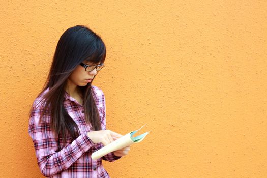 Asian woman reading and studying