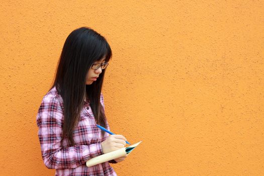 Asian woman reading and studying