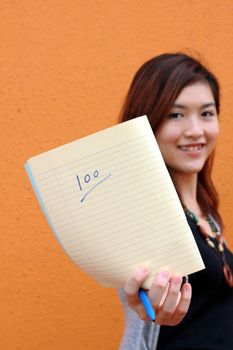 Asian university student showing full marks