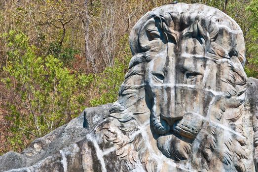 Large lion stone sculpture, taken on sunny afternoon