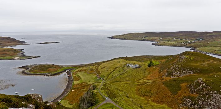 coast in scotland with smooth hills and bushes