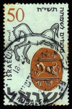 ISRAEL - CIRCA 1957: A stamp printed in Israel, shows ancient hebrew seal from the time of the kings of Israel  -  Tamah son of Miqnemeleh'', circa 1957