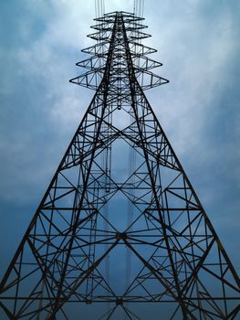 Silhouette of high voltage tower and overcast sky