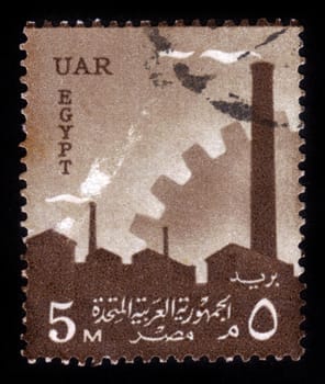 EGYPT - CIRCA 1958: A stamp printed in Egypt shows a factory silhouette and cogwheel, circa 1958