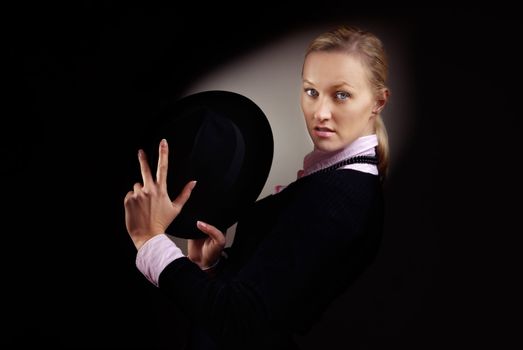 Photo of American blonde in gangster suit and hat with smoke