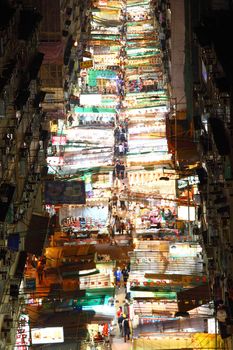 HONG KONG - 9 FEB, The busy Temple Street with many booths setting up to sell local products in Hong Kong at 9 February, 2011. It shows the typical Hong Kong culture from its crowdedness.