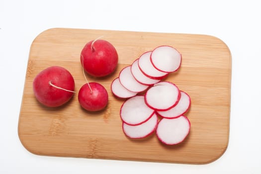 Garden radish on wooden board 