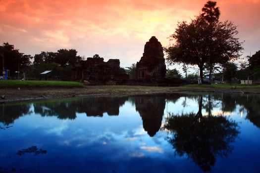 Silhouette of indian style medical center ruin at dusk