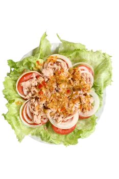 Thai spicy Tuna with Green salad onion and tomato isolated on white