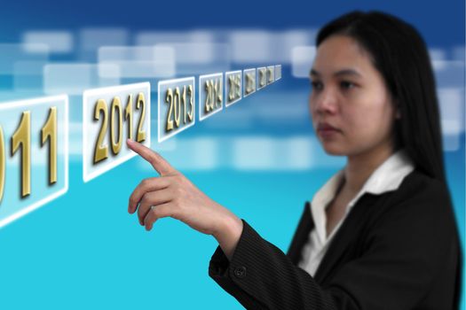 Business woman point to Year 2012 on touch screen interface