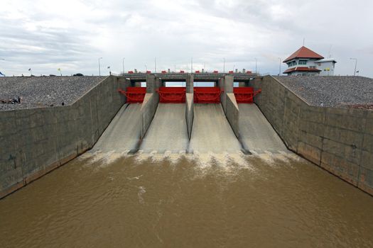 Water pouring through the water gates at dam