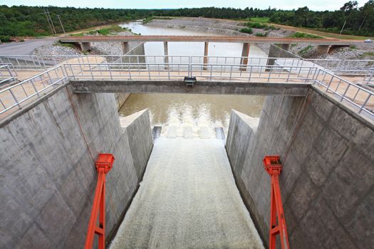 Water pouring through the water gates at dam