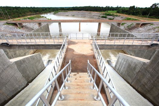 Water pouring through the water gates at dam