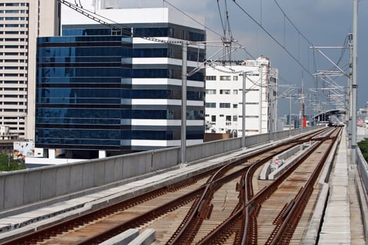 Railway track of sky train in Bangkok Thailand with electric cable line over the track