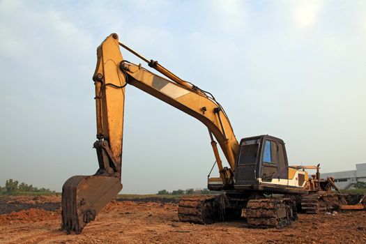 Excavator Loader with backhoe standing in sandpit