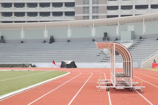 Coach and reserve benches in soccer stadium side view