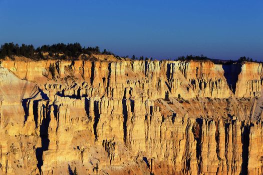 first ray of light on Bryce Canyon National Park, Utah, USA 