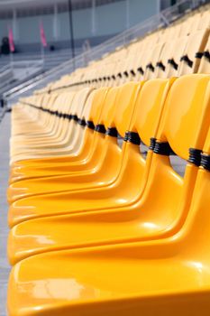 perspective of yellow seat in stadium
