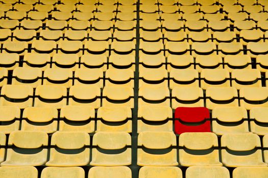 red seat in Yellow Seat Pattern in Football Stadium