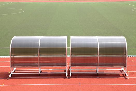 Coach and reserve benches in football soccer stadium