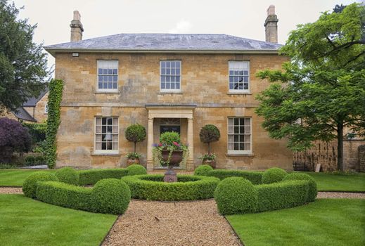 Traditional English village house with a beautiful garden.