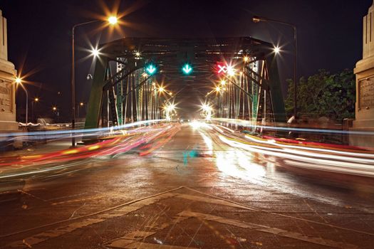Light trail at rama 1 steel bridge at Bangkok harbor