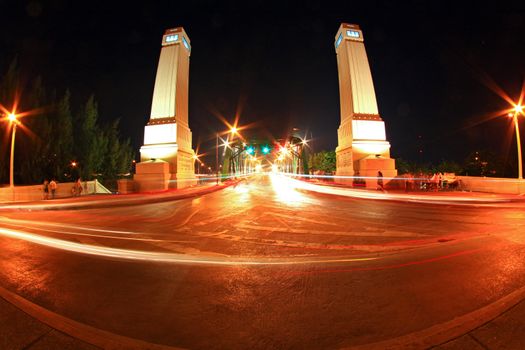 Light trail at rama 1 steel bridge at Bangkok harbor in fish eye perspective