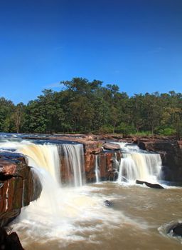 waterfall Tadtone in climate forest of Thailand top perspective, vertical