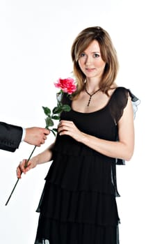 portrait of a young and beautiful girl with a gift and a rose