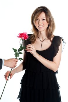 portrait of a young and beautiful girl with a gift and a rose