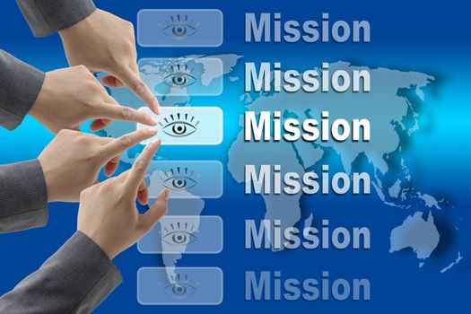 business team pushing on Mission button with world map background